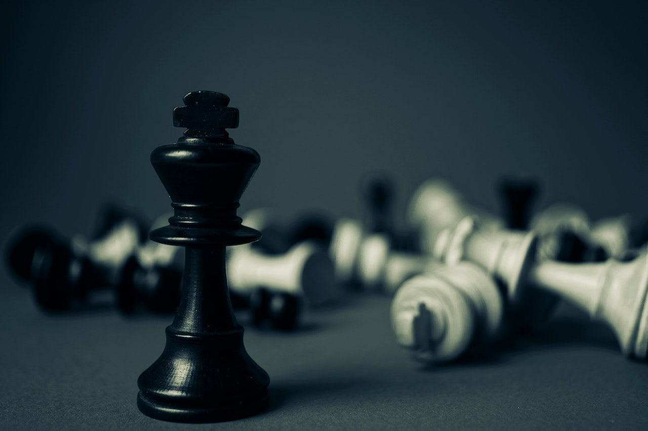 A picture of a chess game where the black king is the last one standing