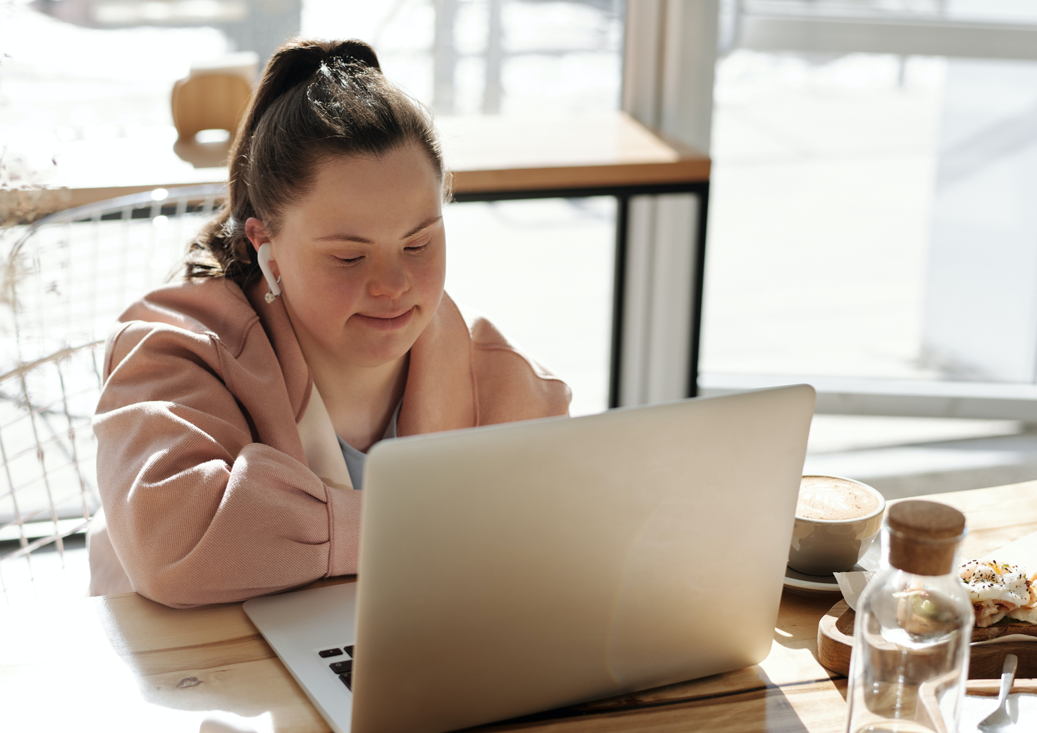 Mentally handicapped girl on laptop