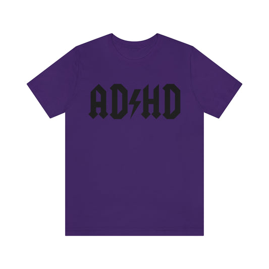 Purple colored t-shirt with black letters and thunderbolt in the middle saying "ADHD"