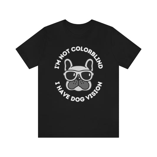 A black t-shirt with an image of a bulldog wearing sunglasses. Around it the text "I'm not colorblind, I have dog vision".