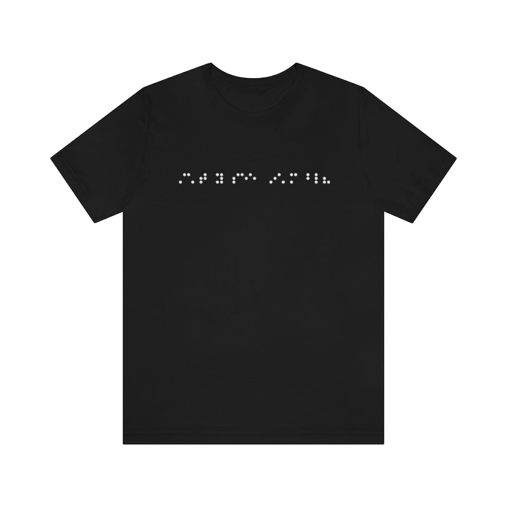 A black shirt with braille on it in white. The braille reads "Can't you see I'm blind?"