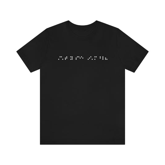 A black shirt with braille on it in white. The braille reads "Can't you see I'm blind?"
