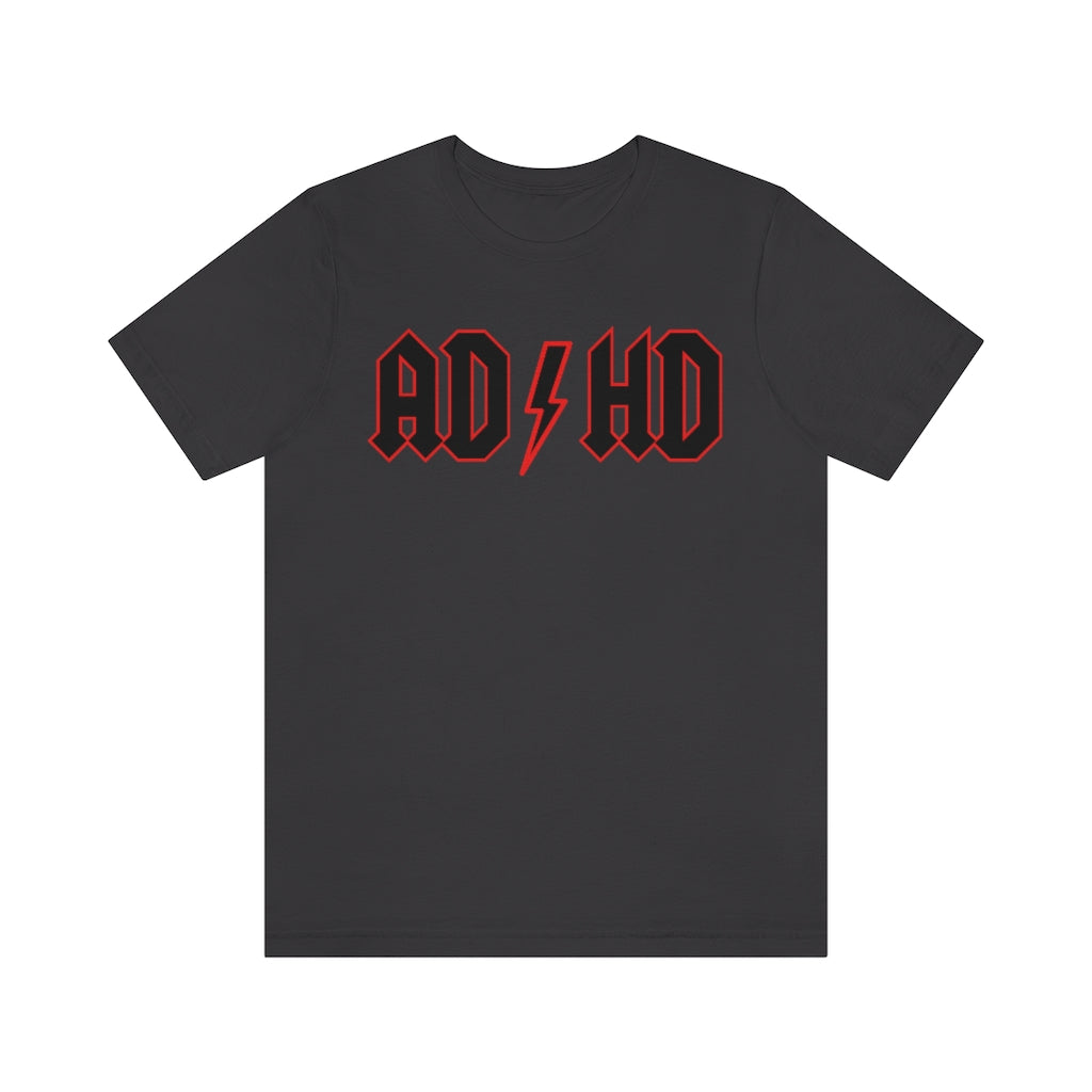 Dark grey colored t-shirt with black letters with a red outline and thunderbolt in the middle saying "ADHD"