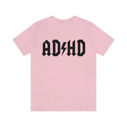 Pink colored t-shirt with black letters and thunderbolt in the middle saying "ADHD"