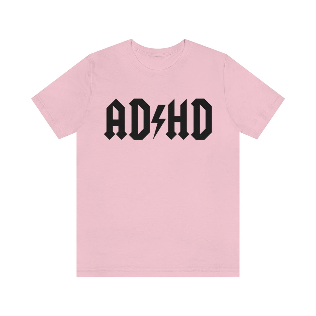 Pink colored t-shirt with black letters and thunderbolt in the middle saying "ADHD"