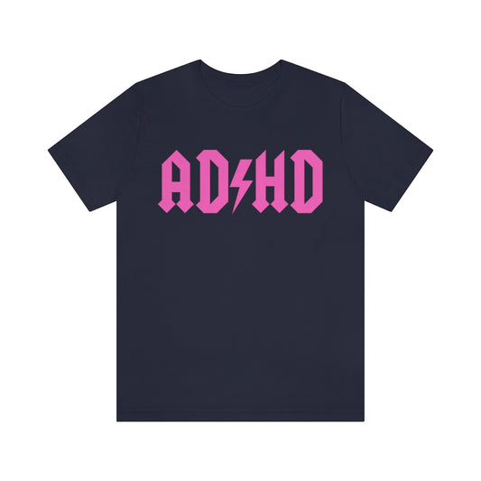 Navy colored t-shirt with pink letters and thunderbolt in the middle saying "ADHD"
