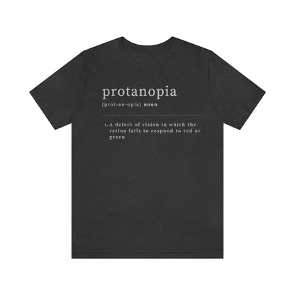 A dark grey heather colored t-shirt with text laid out like a dictionary. It reads in white letters: "protanopia, noun. A defect of vision in which the retina fails to respond to red or green."