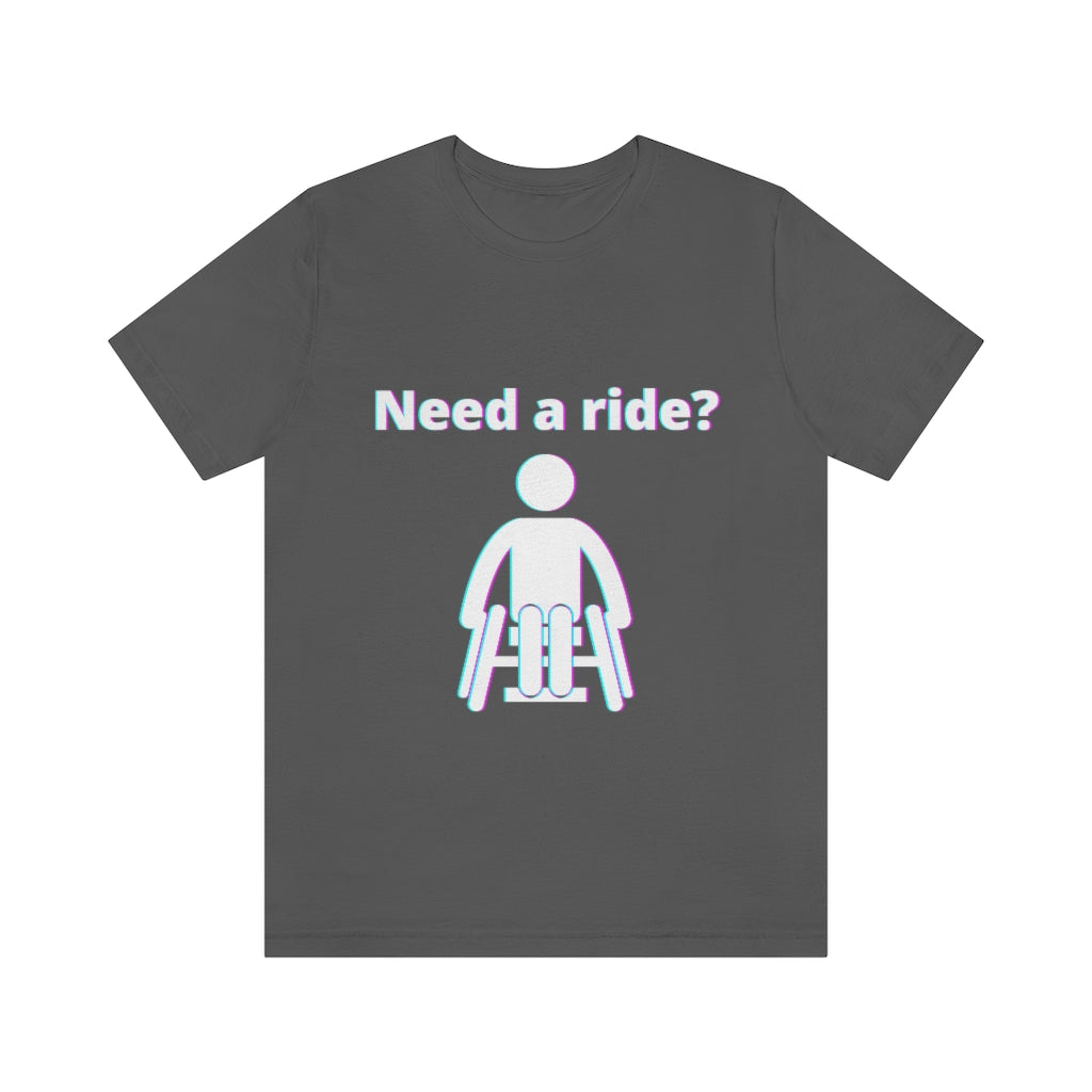 Asphalt colored t-shirt with a person in wheelchair with text in glitch effect saying: "Need a ride?"