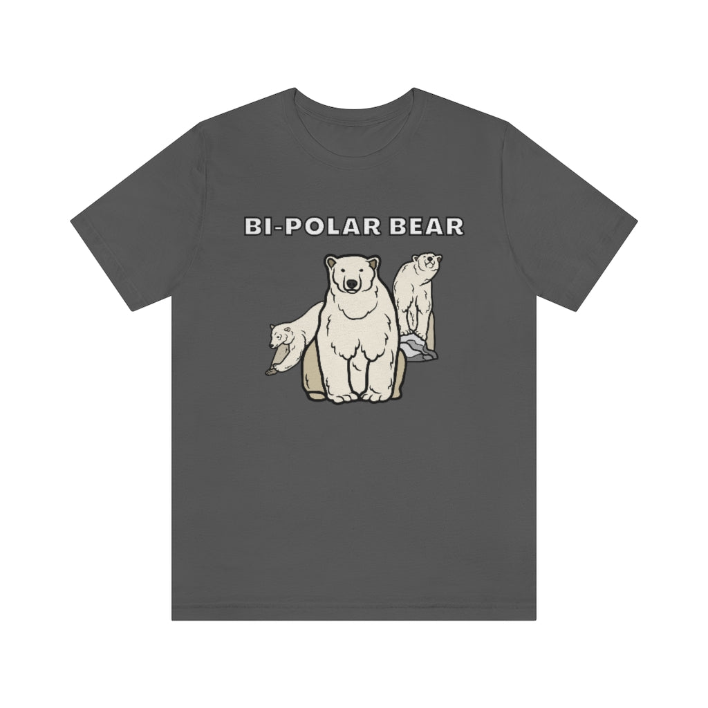 A ash-colored t-shirt with white text saying: "Bi-Polar bear). Under it are 3 bears: One staring neutrally at the viewer, on the right one on a rock looking happy and on the left one looking sad while jumping away.