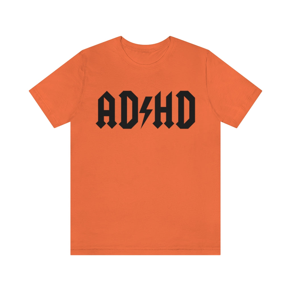 Orange colored t-shirt with black letters and thunderbolt in the middle saying "ADHD"