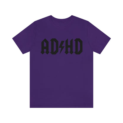 Purple colored t-shirt with black letters and thunderbolt in the middle saying "ADHD"
