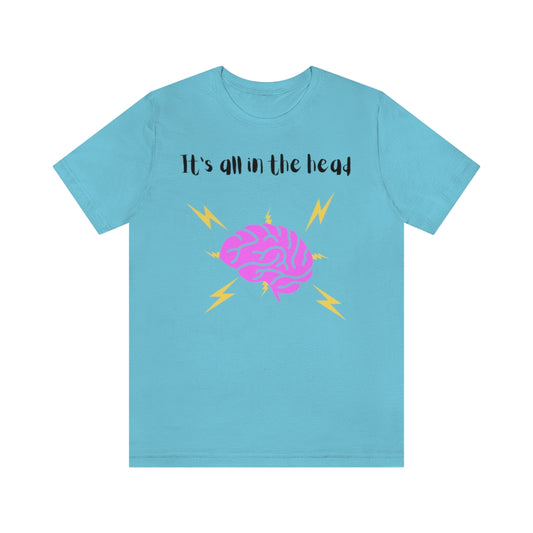 A turquoise t-shirt with the text "It's all in the head" with a drawing of a brain under it with thunderbolts and lightning around it.