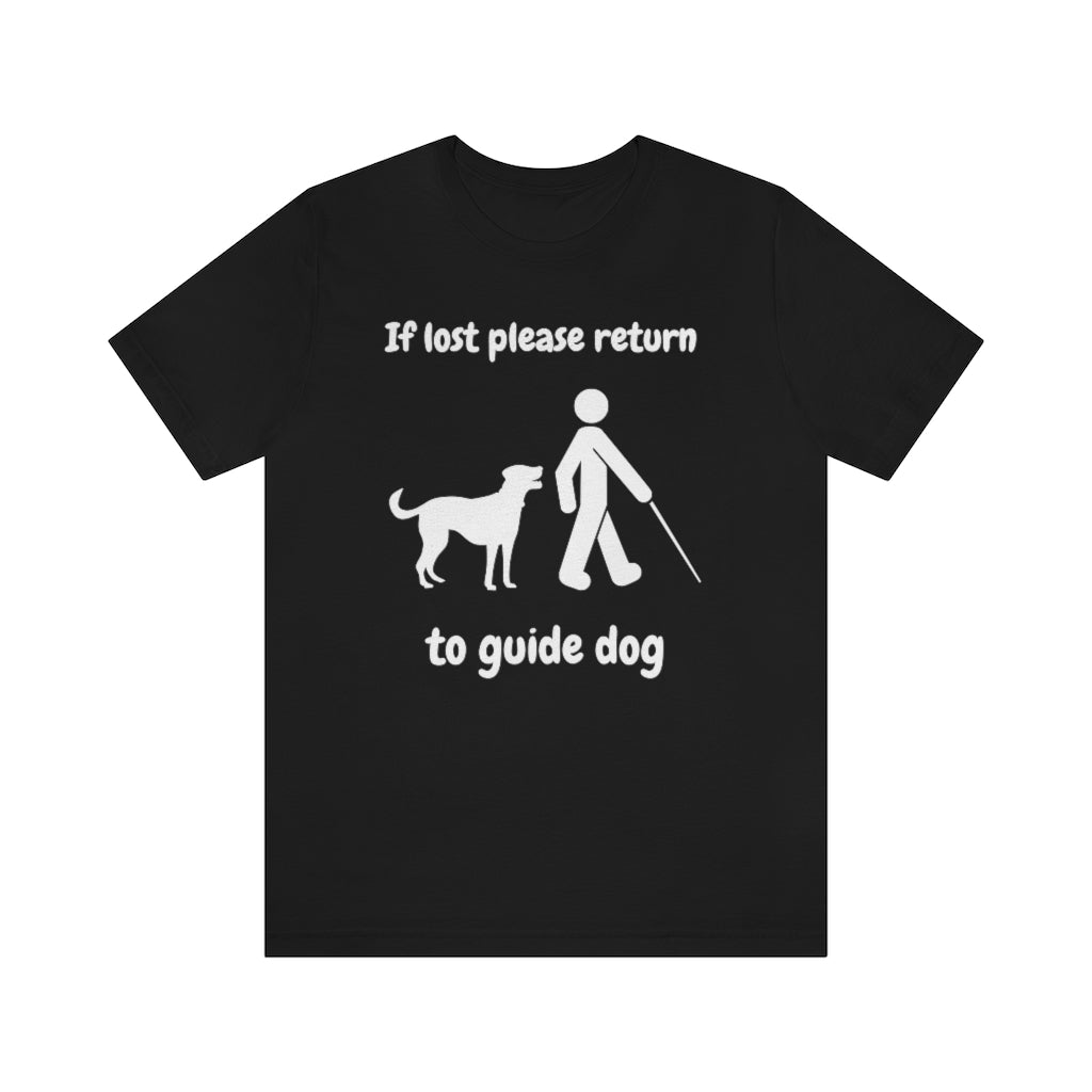 A black t-shirt with the text "If lost please return to guide dog",with a picture of a man with a cane walking away from a dog.
