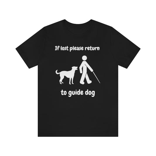 A black t-shirt with the text "If lost please return to guide dog",with a picture of a man with a cane walking away from a dog.
