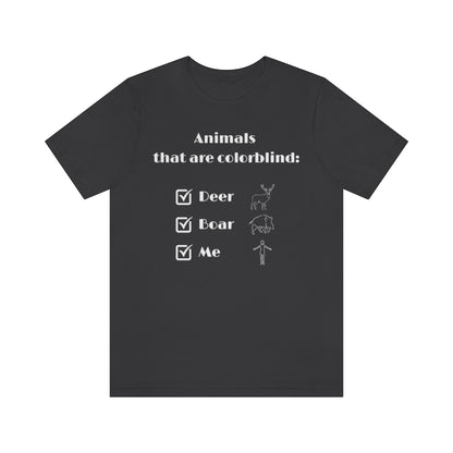 A dark gray colored T-shirt with white text reading: "Animals that are colorblind:". Under it are 3 checked boxes with the words "Deer", "Boar" and "Me". Behind these are outline drawings showing the animals and a human.