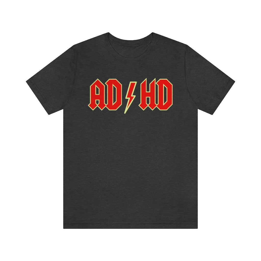 Dark grey heather t-shirt with red letters with a yellow outline and thunderbolt in the middle saying "ADHD"