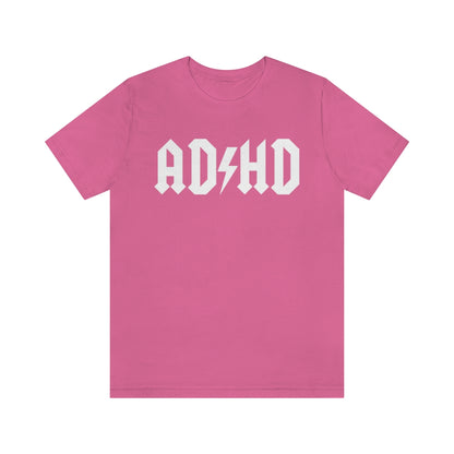 Charity pink colored t-shirt with white letters with and thunderbolt in the middle saying "ADHD"