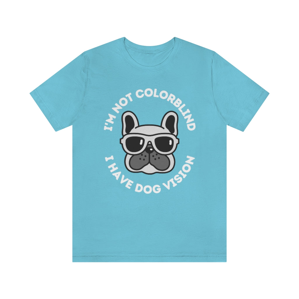 A turquoise t-shirt with an image of a bulldog wearing sunglasses. Around it the text "I'm not colorblind, I have dog vision".