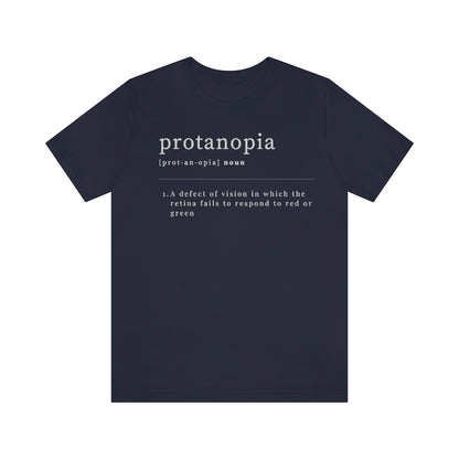 A navy t-shirt with text laid out like a dictionary. It reads in white letters: "protanopia, noun. A defect of vision in which the retina fails to respond to red or green."
