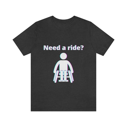 Dark grey t-shirt with a person in wheelchair with text in glitch effect saying: "Need a ride?"